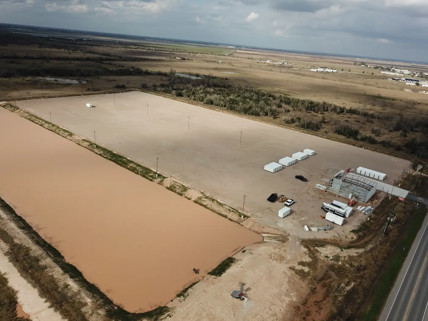Night aerial of the LockRig truck yard showing LED lighting across the full lot and wide drive aisles